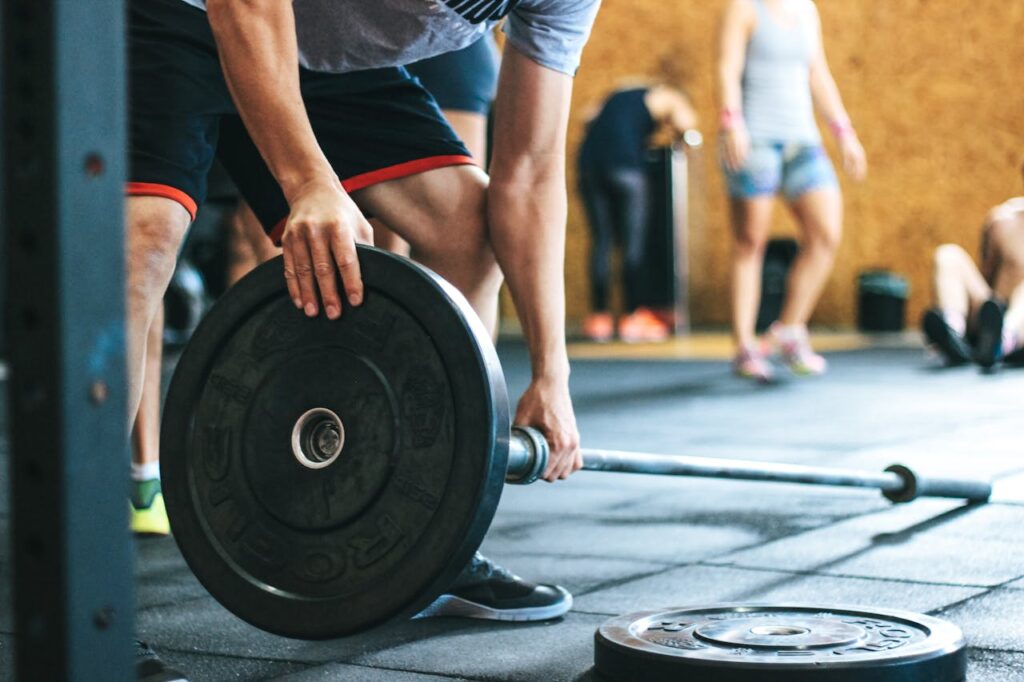 Male Lifting Black Barbell